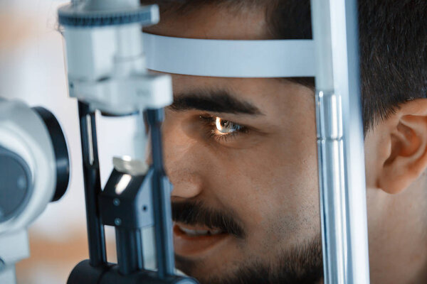 Patient or customer at slit lamp 