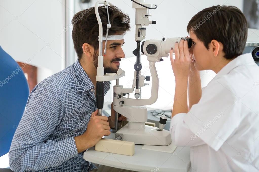 Patient or customer at slit lamp 