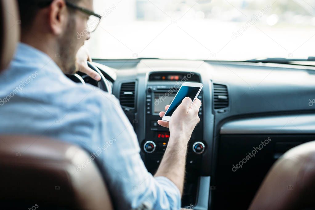 Businessman ignoring safety and texting 