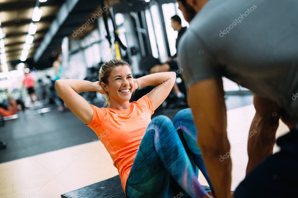 Young beautiful woman doing exercises 