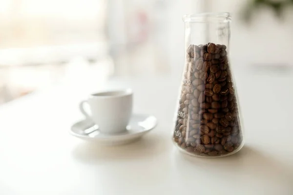 Coffee beans  with cappuccino — Stock Photo, Image
