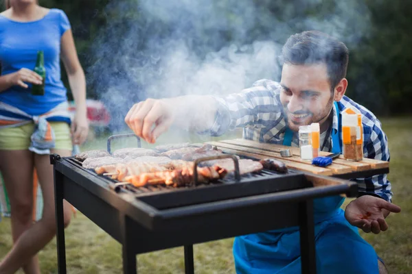 Happy male preparing bbq meat — Stock Photo, Image