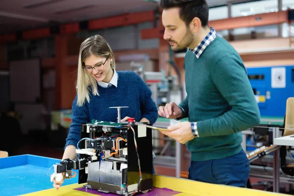 Students  preparing robot for testing — Stock Photo, Image