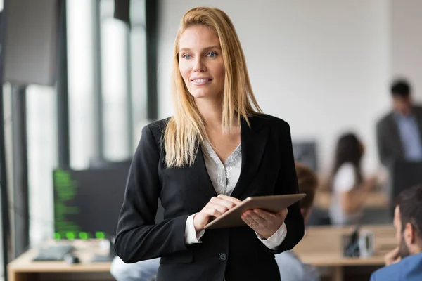 Successful businesswoman holding digital tablet — Stock Photo, Image