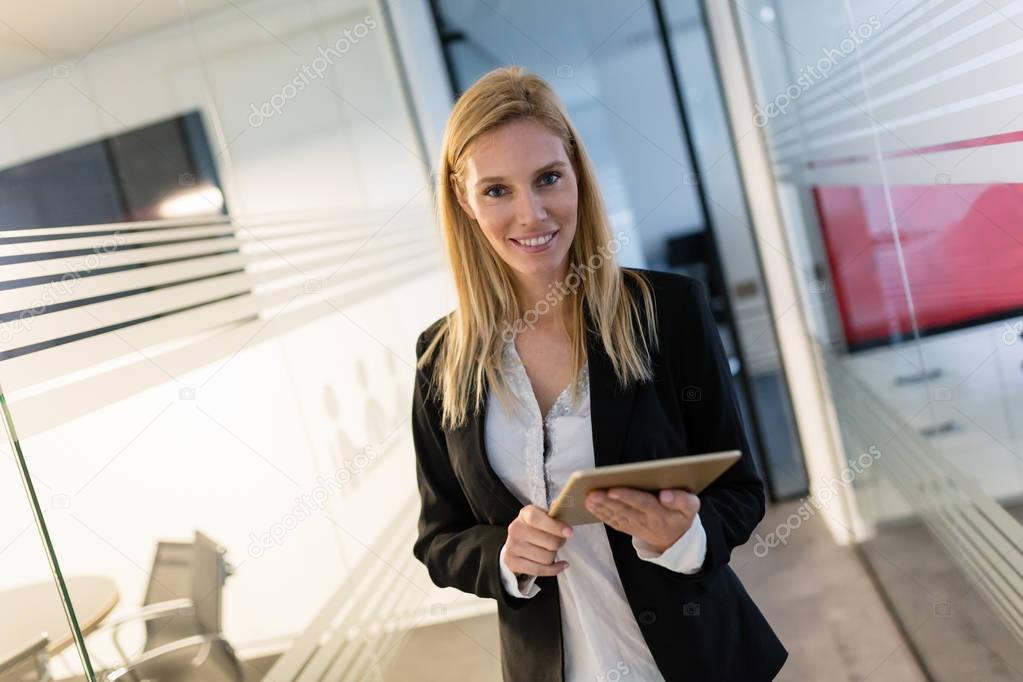  businesswoman holding digital tablet