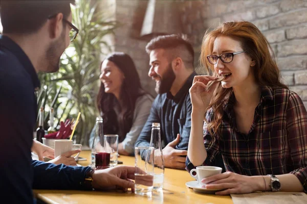 Colleagues from work socializing in restaurant — Stock Photo, Image