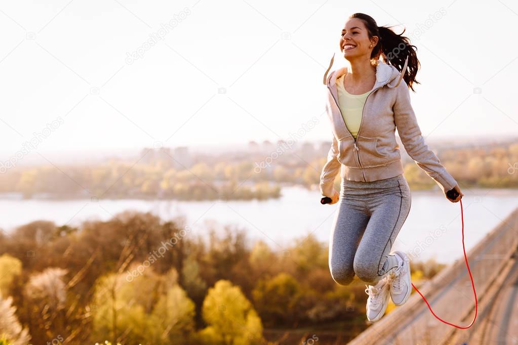  woman jumping with skipping rope