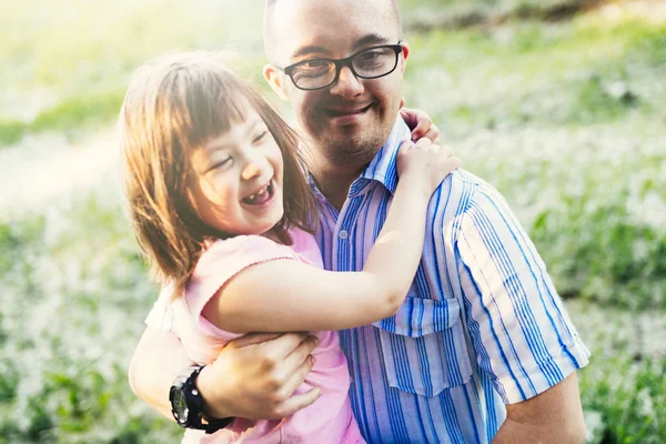 Picture of girl and man with down syndrome — Stock Photo, Image