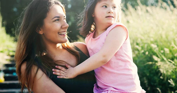 Girl with special needs with mother — Stock Photo, Image