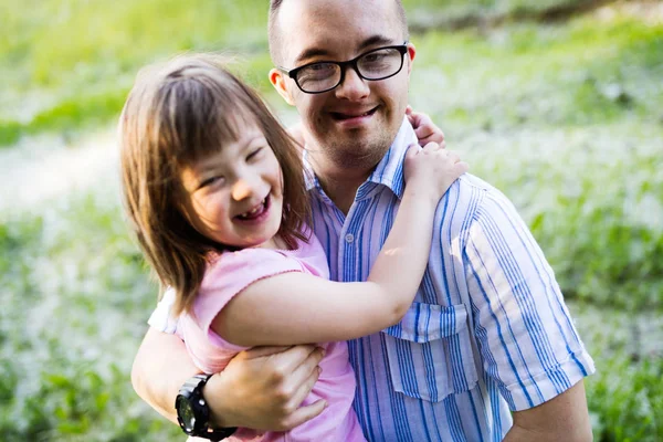 Picture of girl and man with down syndrome — Stock Photo, Image