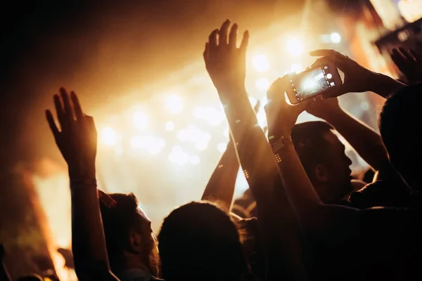 Cheering crowd with hands