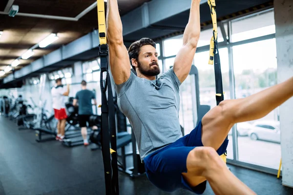 Strong man doing exercises — Stock Photo, Image