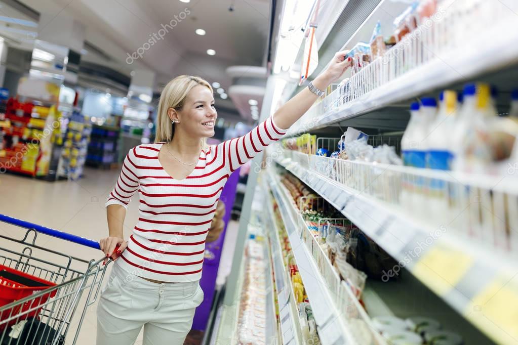 woman shopping in supermarket