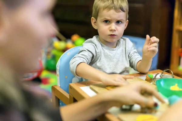 Kid playing with playdough — Stock Photo, Image