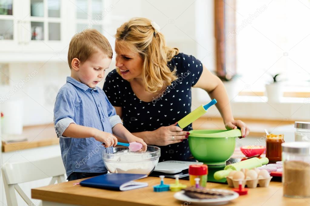 Beautiful child and mother baking