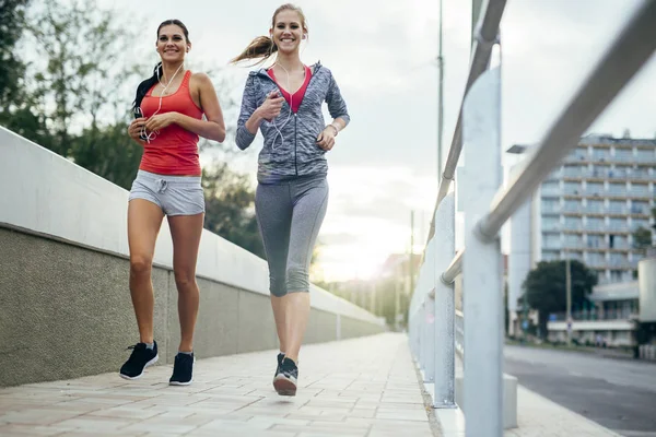 Beautiful two female joggers — Stock Photo, Image