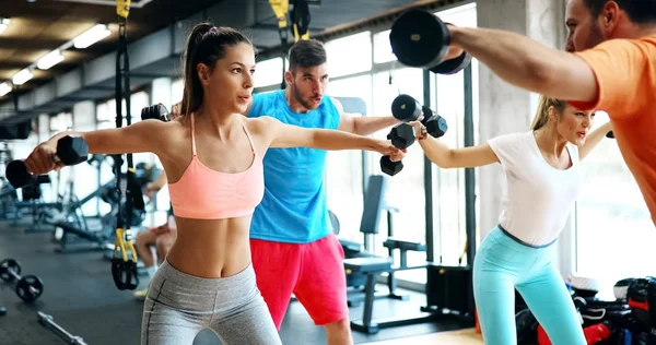 People have workout in gym Stock Photo by ©nd3000 157845922