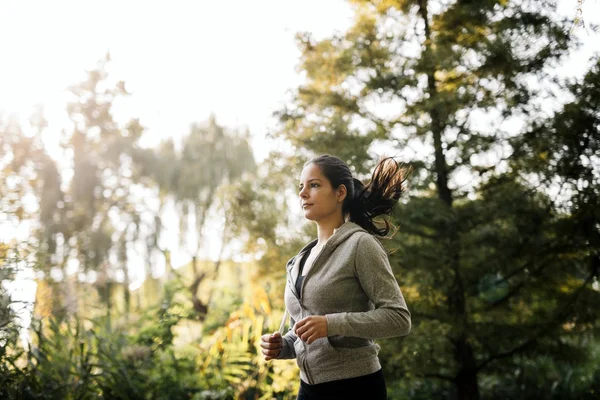 Woman running in park