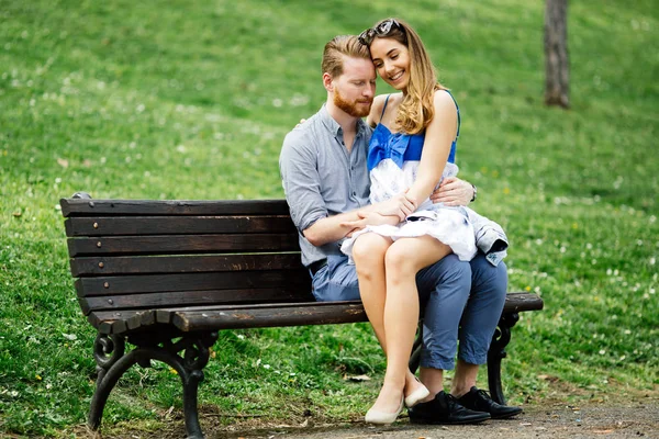 Romantic couple in love on bench — Stock Photo, Image