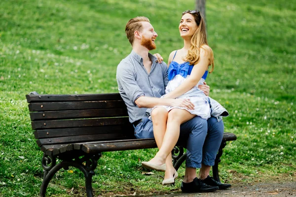 Romantic couple in love on bench — Stock Photo, Image