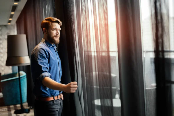 Handsome man looking at cityscape