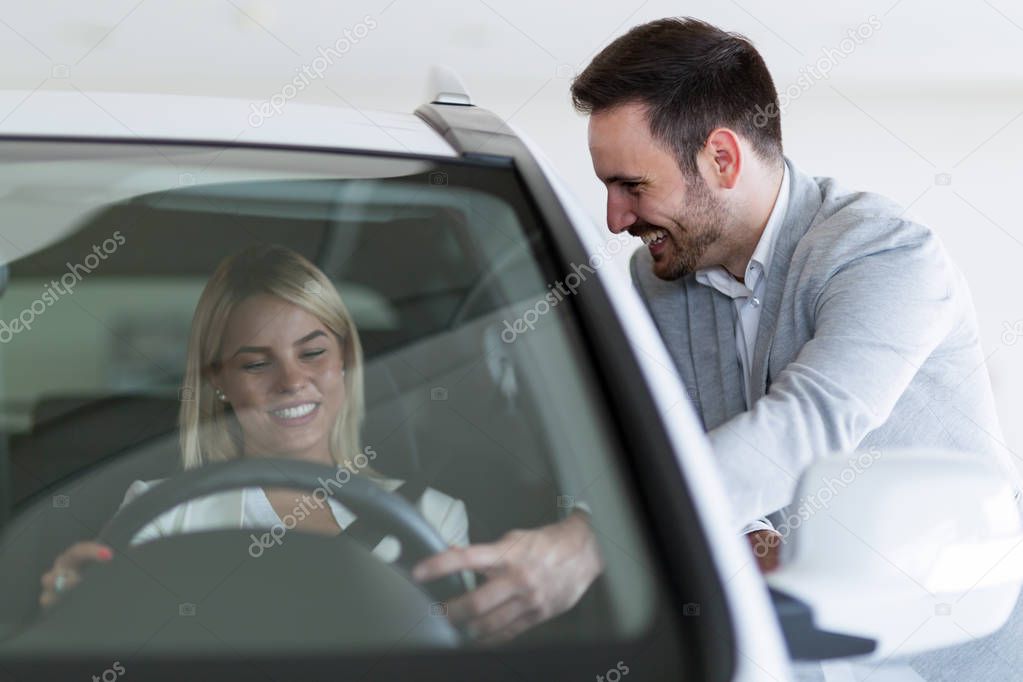 Customer looking at car at dealership
