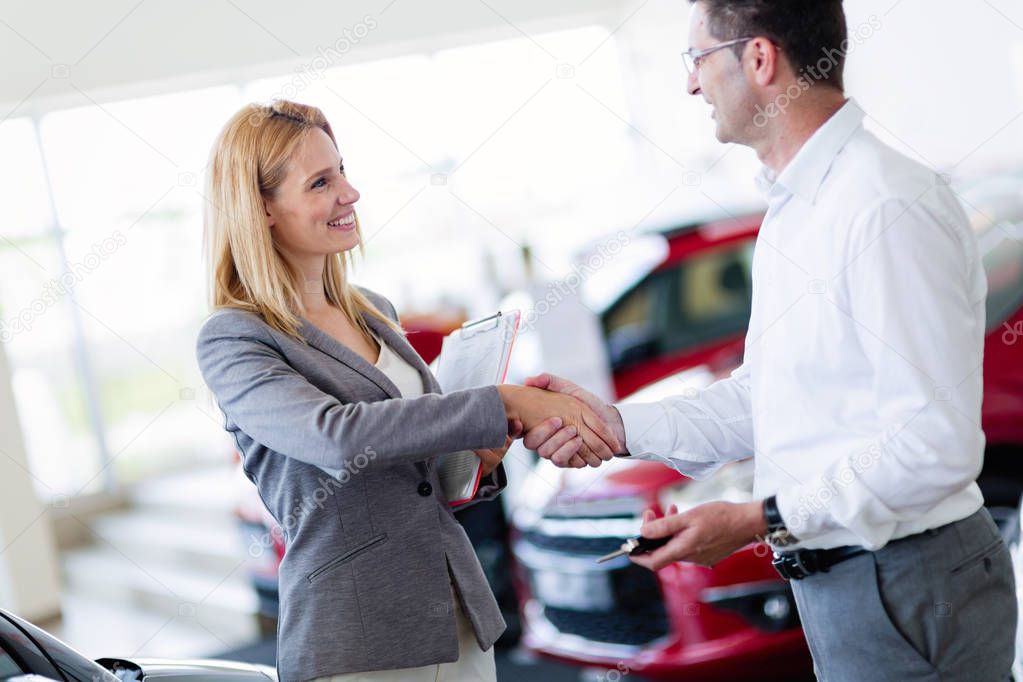 Professional salesperson selling cars 