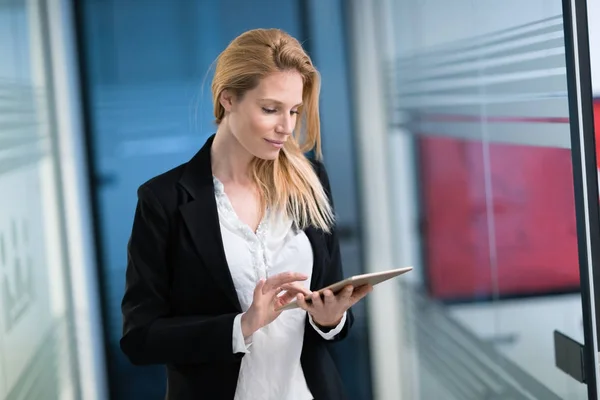 Businesswoman using digital tablet in office — Stock Photo, Image