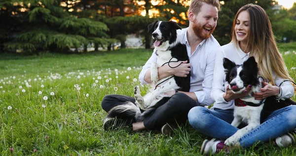 Couple enjoying their time with pets — Stock Photo, Image