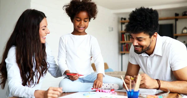 Mother and father drawing together with  child — Stock Photo, Image