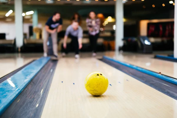 Friends enjoying bowling at club