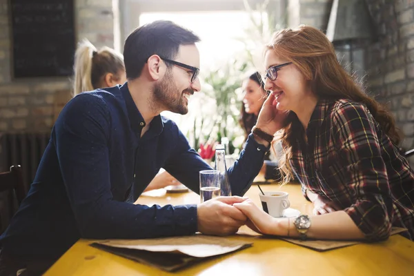 Group of young coworkers socializing in restaurant — Stock Photo, Image