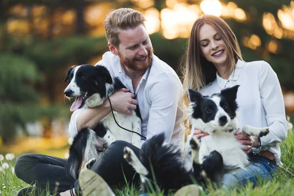 couple enjoying their time with pets