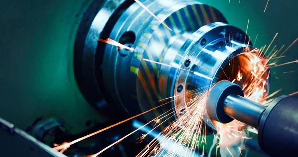 Sparks flying while machine griding — Stock Photo, Image