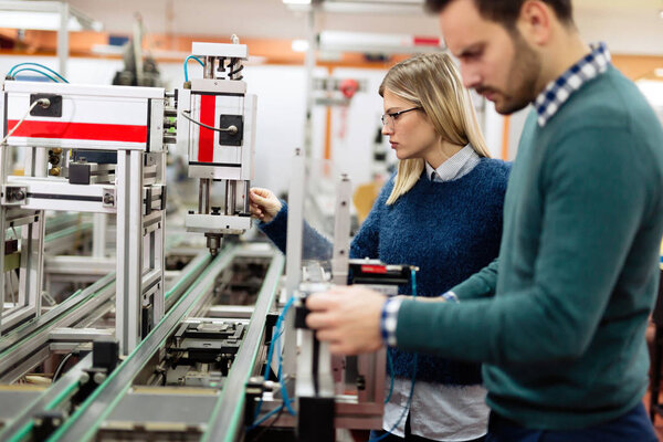 engineers working on electronics components