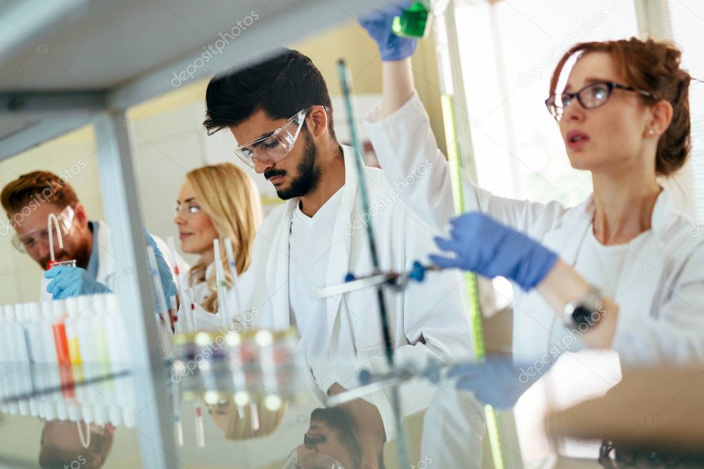 Group of scientists working at laboratory
