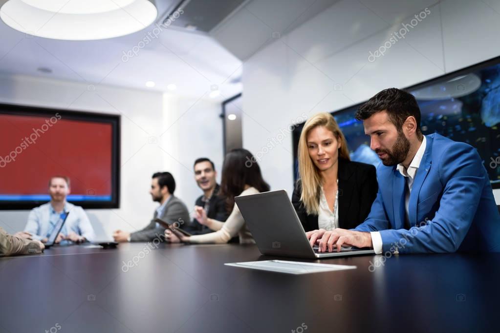 Picture of business couple working on laptop on meeting