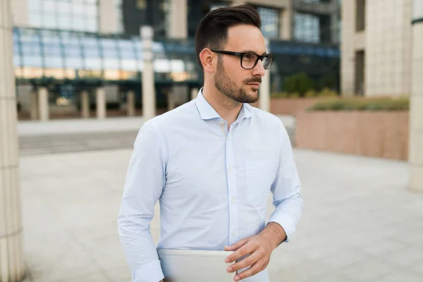 Businessman having tablet and phone at hand — Stock Photo, Image