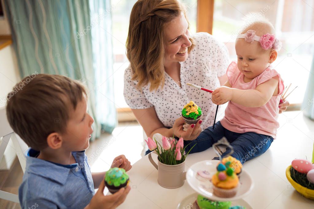 Happy time while painting easter eggs