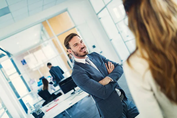 Business people having fun and chatting at workplace office