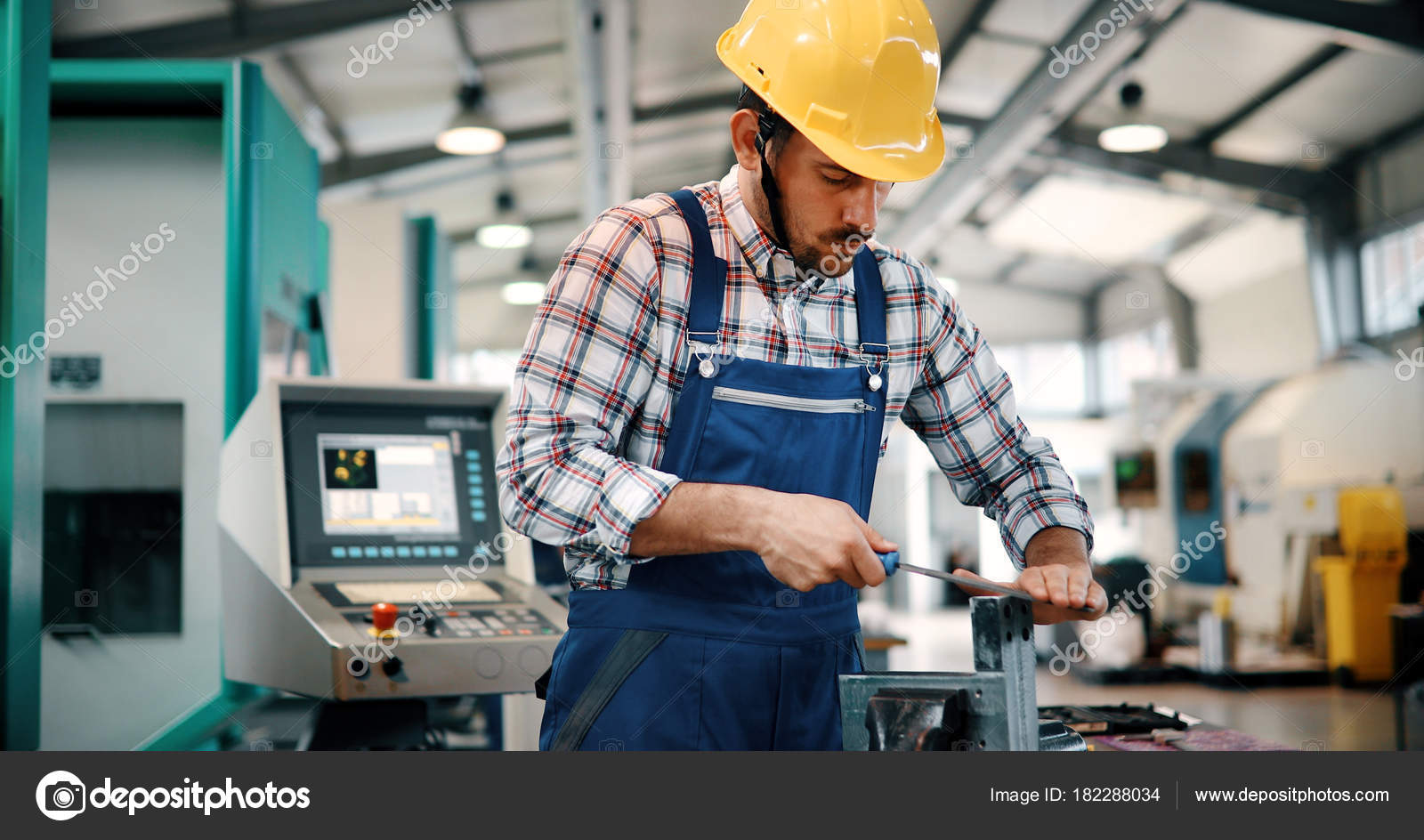 Modern Industrial Machine Operator Working Metal Industry Factory Stock