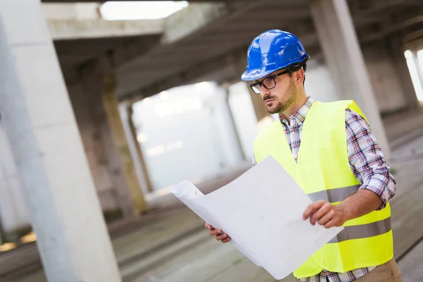 Engineers Working Building Site Holding Blue Prints — Stock Photo, Image