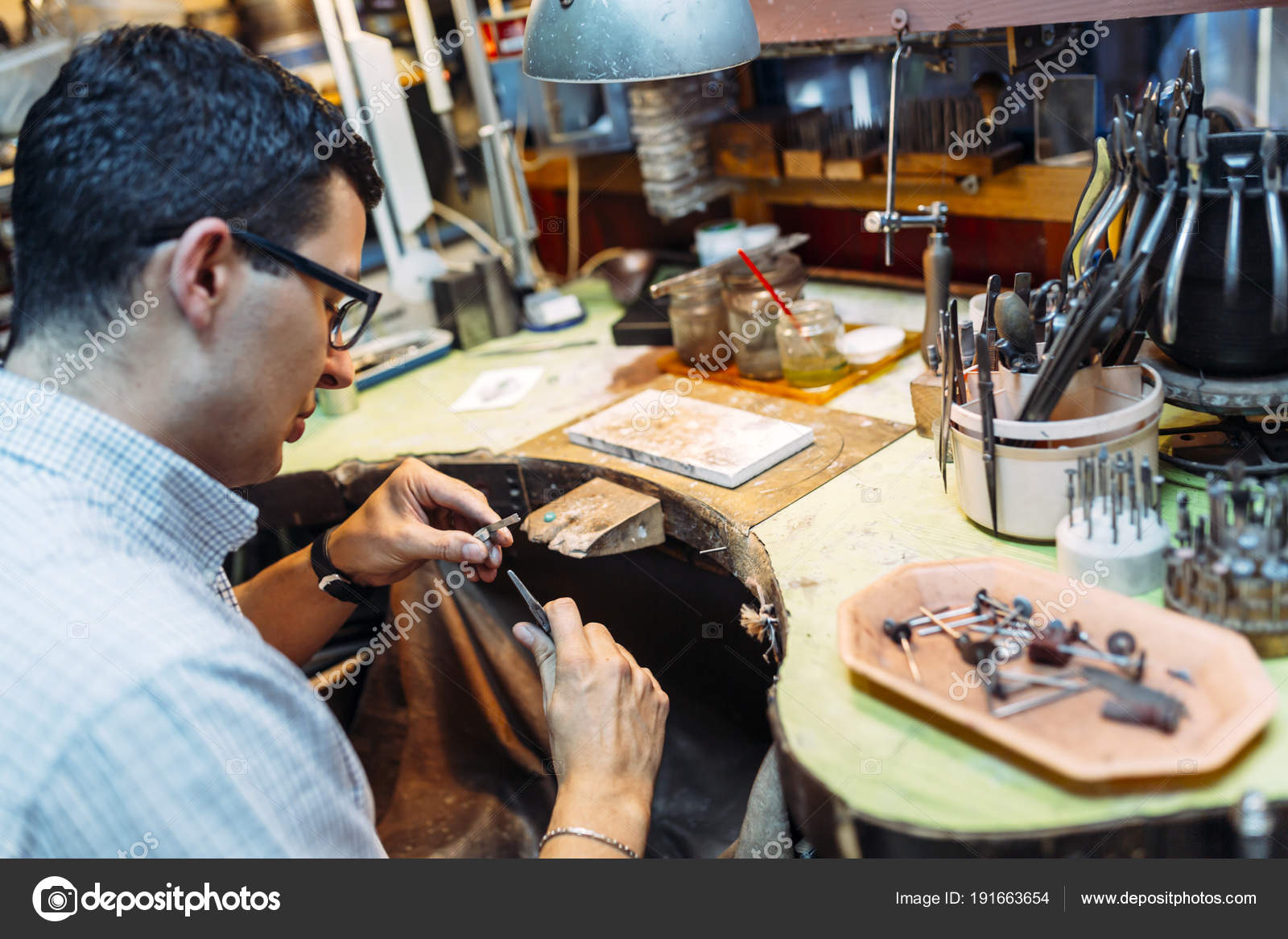 Goldsmith Working His Bench Crafting Jewelry Stock Photo by ©nd3000 191663654