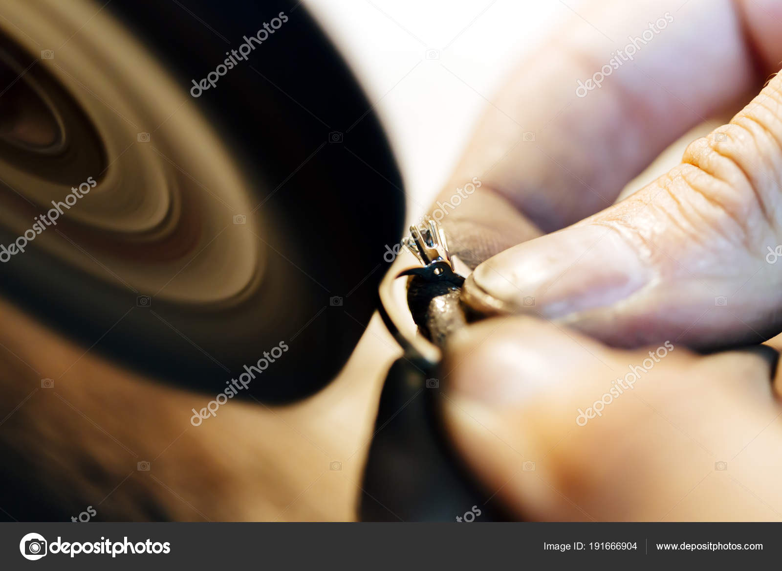 https://st3.depositphotos.com/5392356/19166/i/1600/depositphotos_191666904-stock-photo-jewelery-polishing-ring-workshop-adequate.jpg