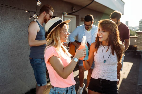 Beautiful happy friends laughing and smiling outdoors