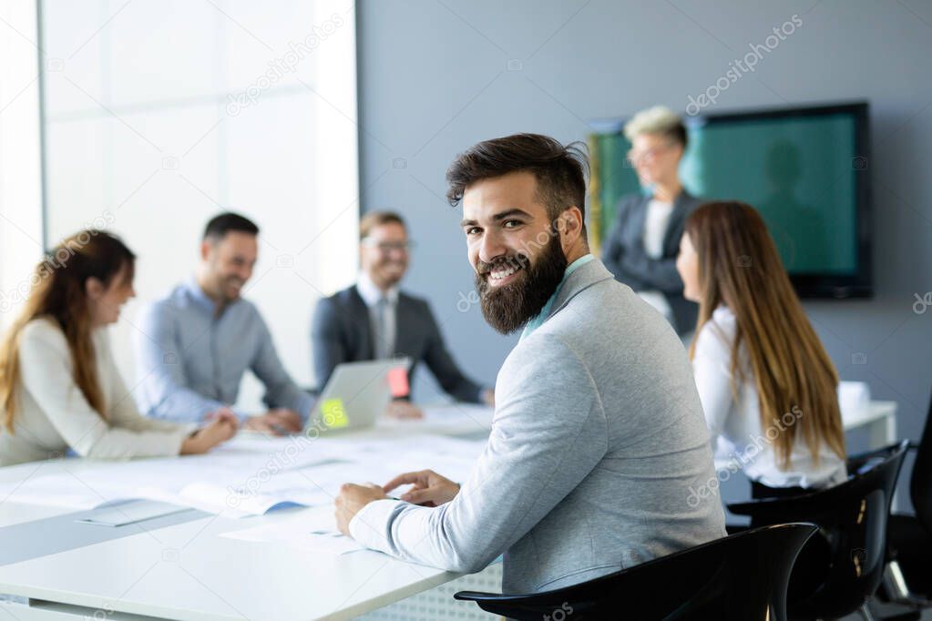 Business colleagues in conference meeting room during presentation