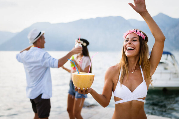 Group of friends having fun at summer party