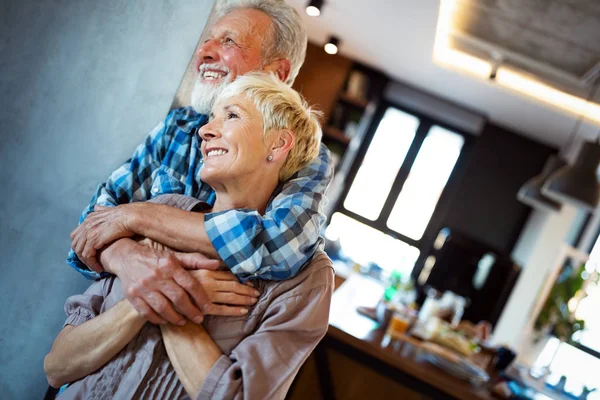 Happy Smiling Senior Couple Embracing Together Enjoying Retirement Home — Stock Photo, Image