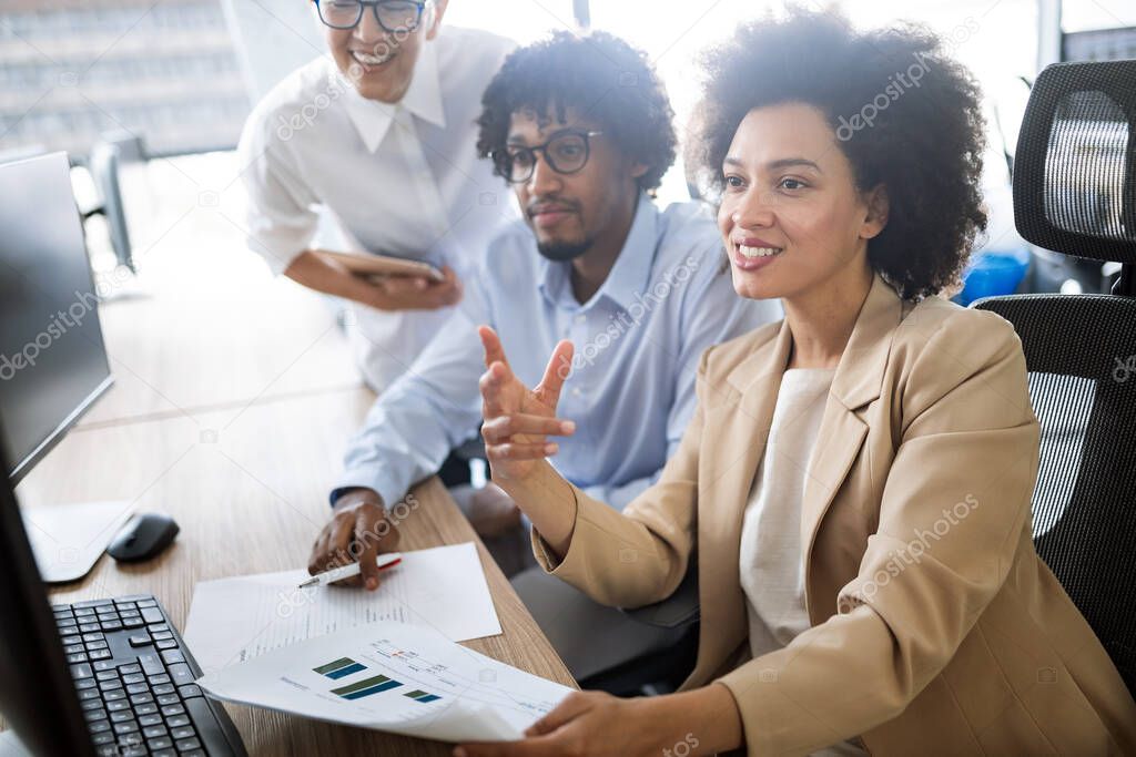 Group of successful happy business people at work in office