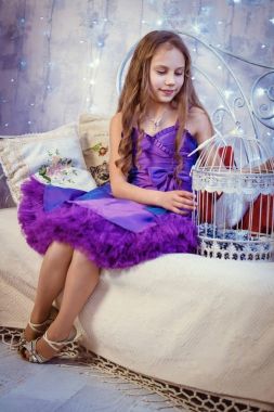 Child girl in a Christmas interior. clipart